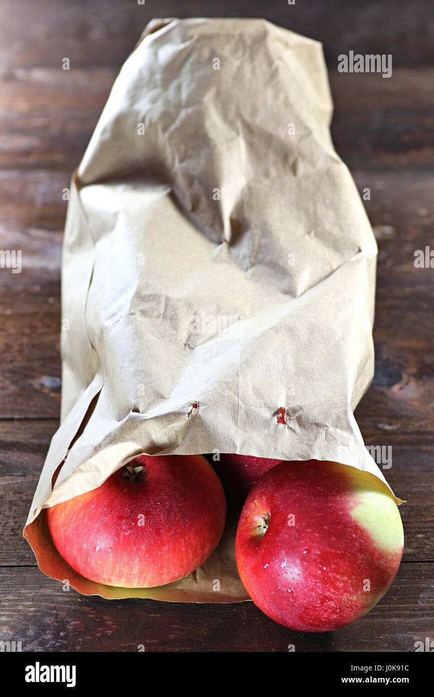 apples (variety Elstar) in a paper bag on wooden background Stock Photo
