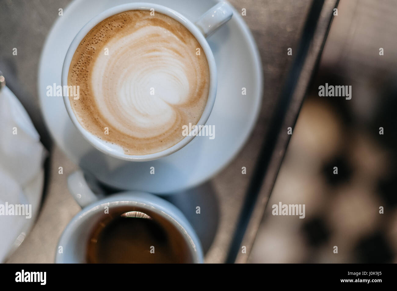 Cup of Caffe Latte Photographed from Above with a Shot of Espresso Next ...