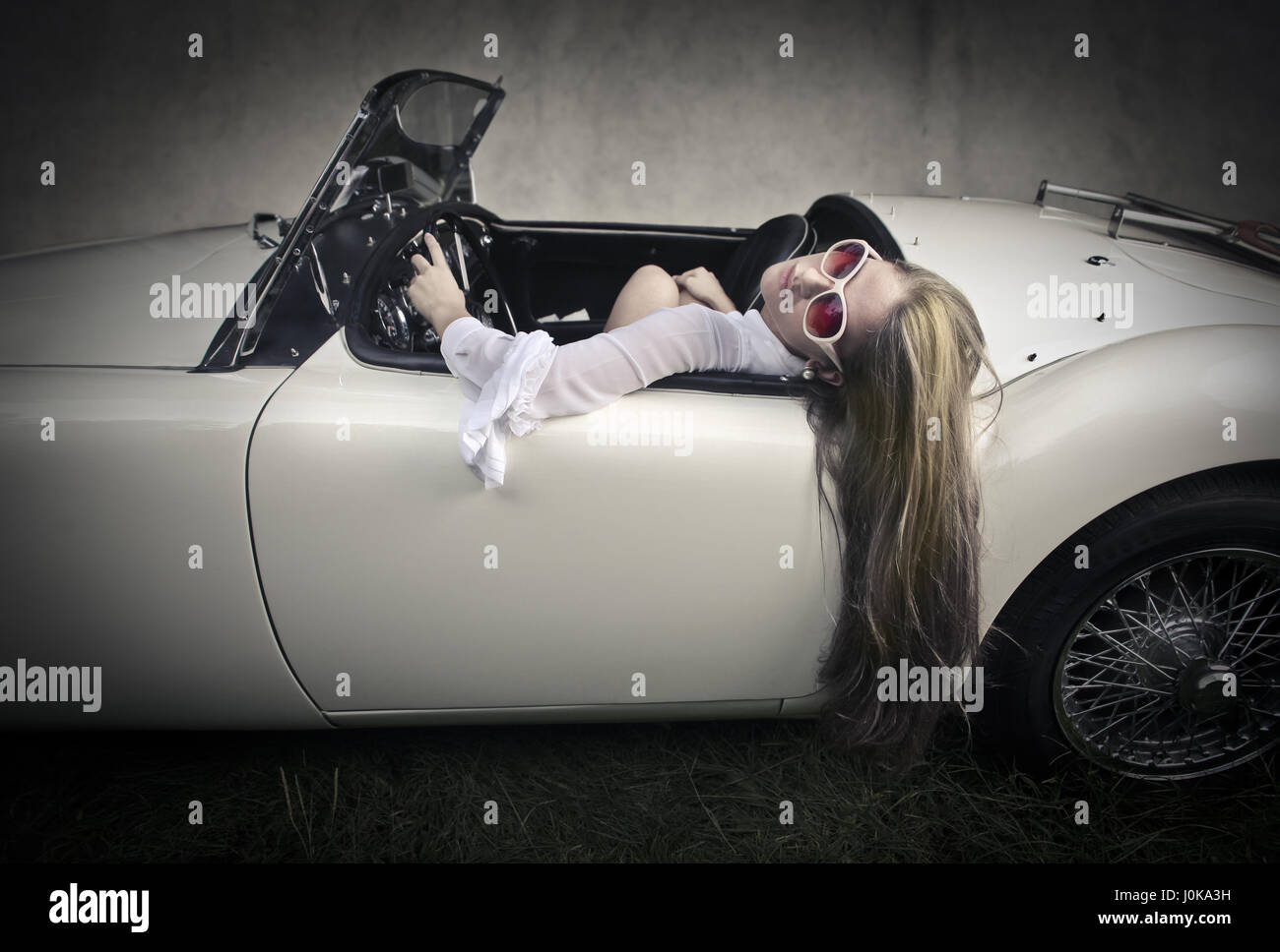 Girl laying car hires stock photography and images Alamy