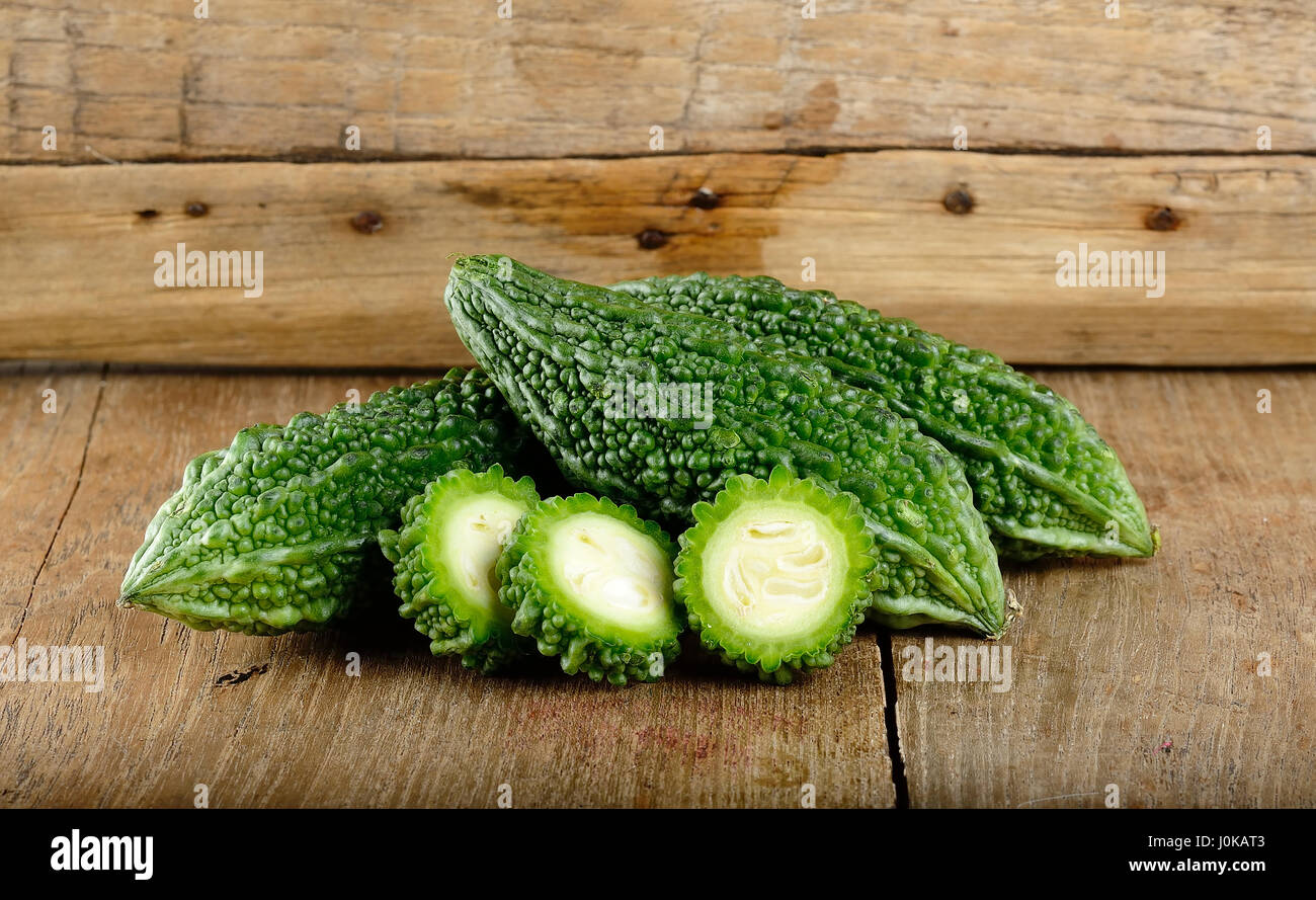 Green Bitter Gourd On The Wooden Background Stock Photo Alamy