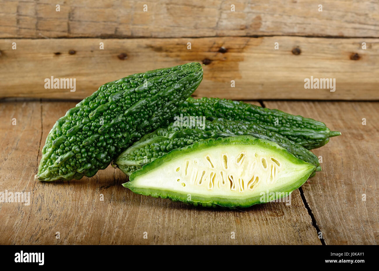 Green Bitter Gourd On The Wooden Background Stock Photo Alamy
