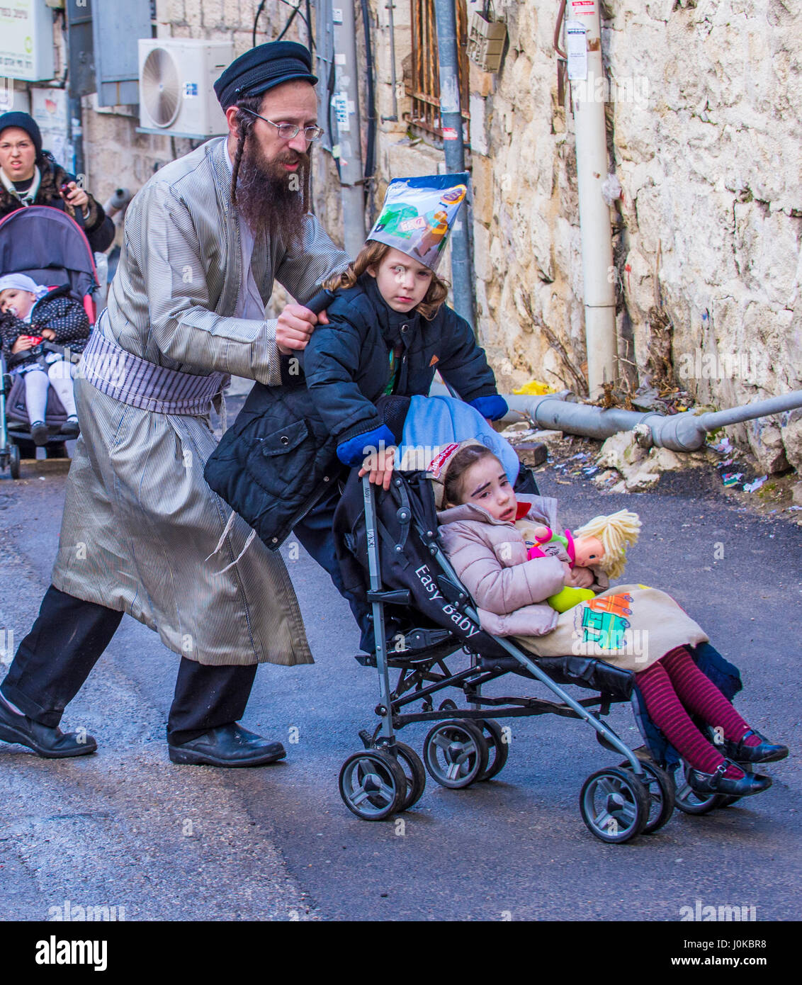 Ultra Orthodox family during Purim in Mea Shearim Jerusalem Stock Photo