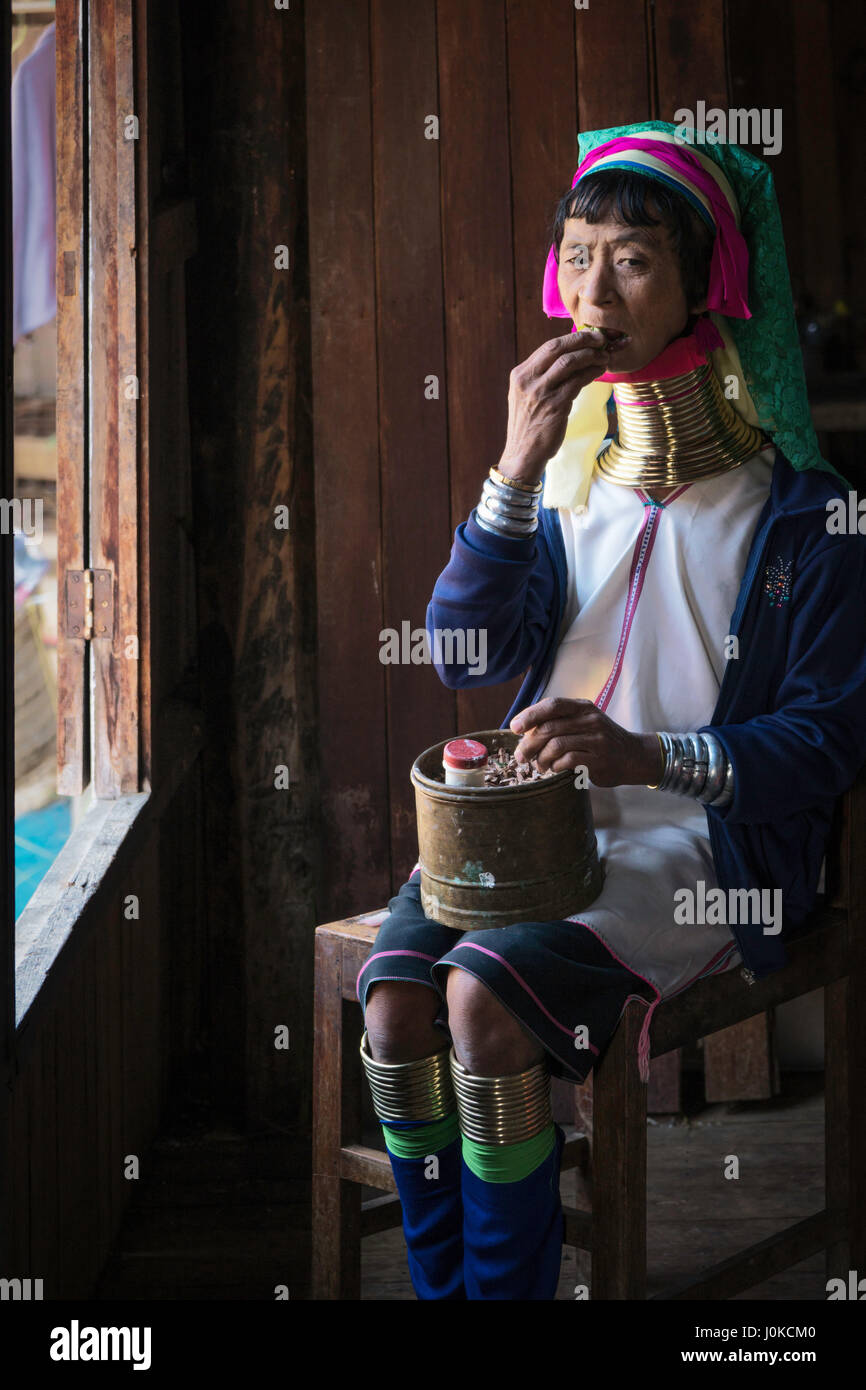 Older woman from the Kayan tribe chewing on betel leaves in Ywama village, Inle lake, Shan state, Myanmar Stock Photo