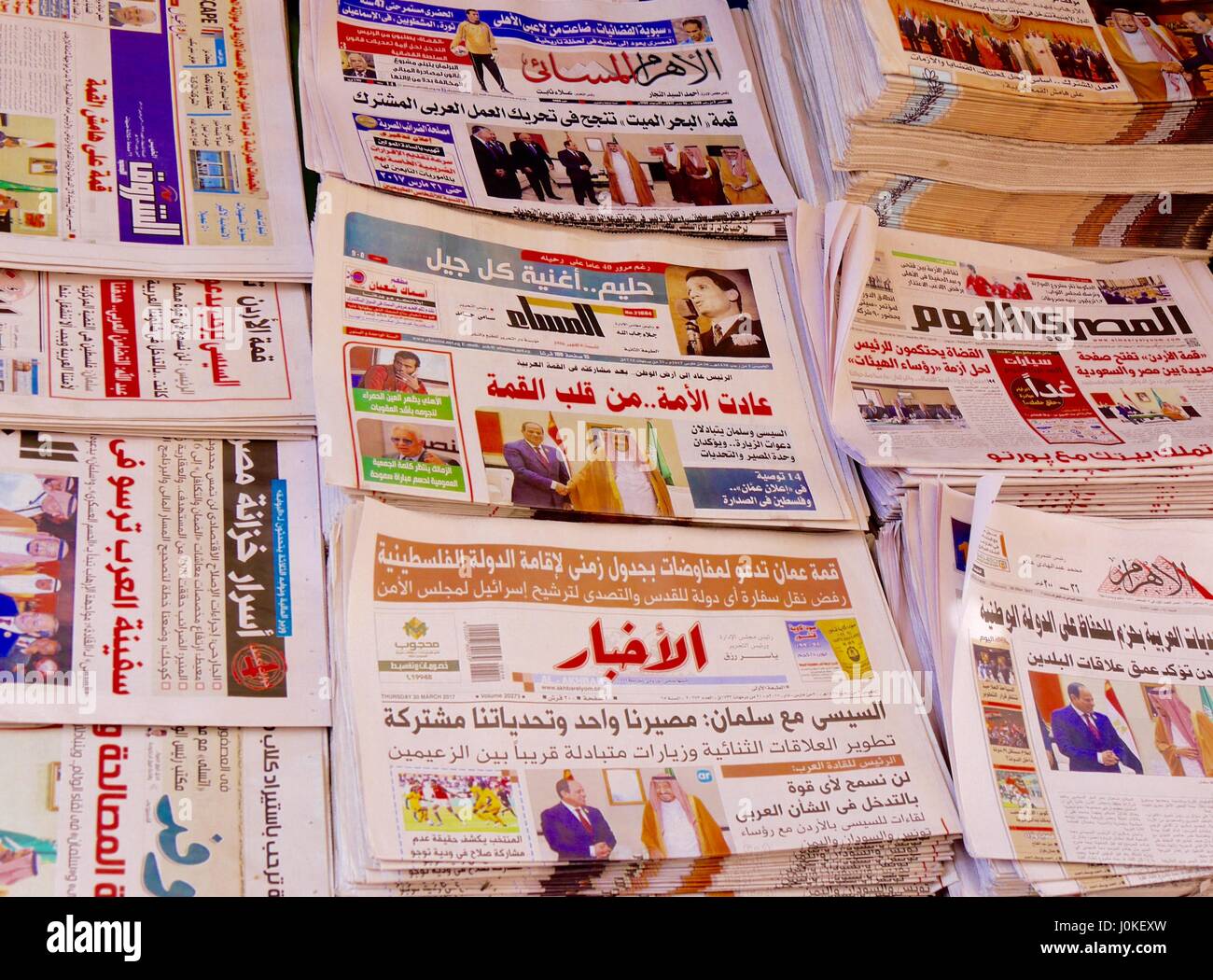 Display of Arabic-language newspapers on sale on newsstand in Cairo, Egypt Stock Photo