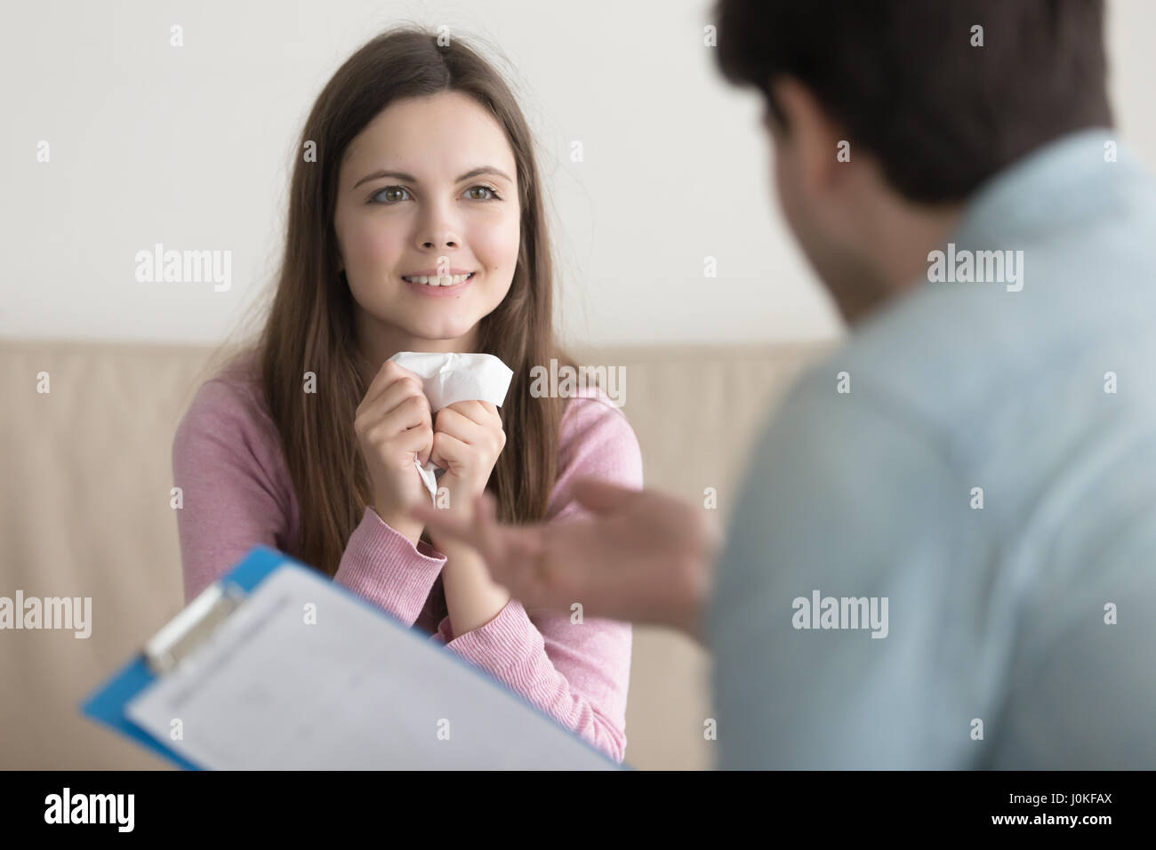 Woman feeling emotional relief, cry with happiness at the psycho Stock Photo