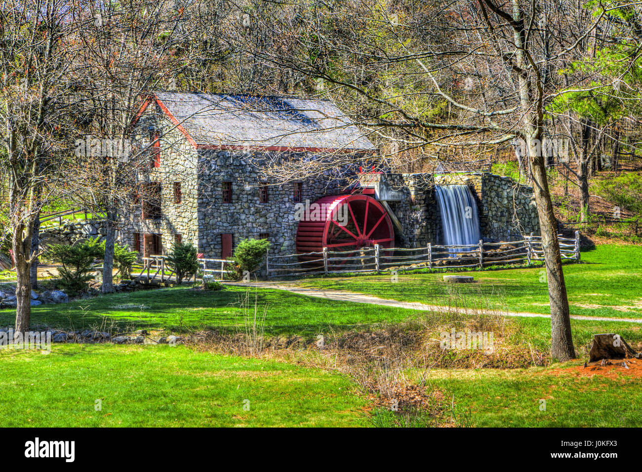 Facade of Longfellow's Wayside Inn Grist Milland waterwheel in Sudbury, Massachusetts. Stock Photo