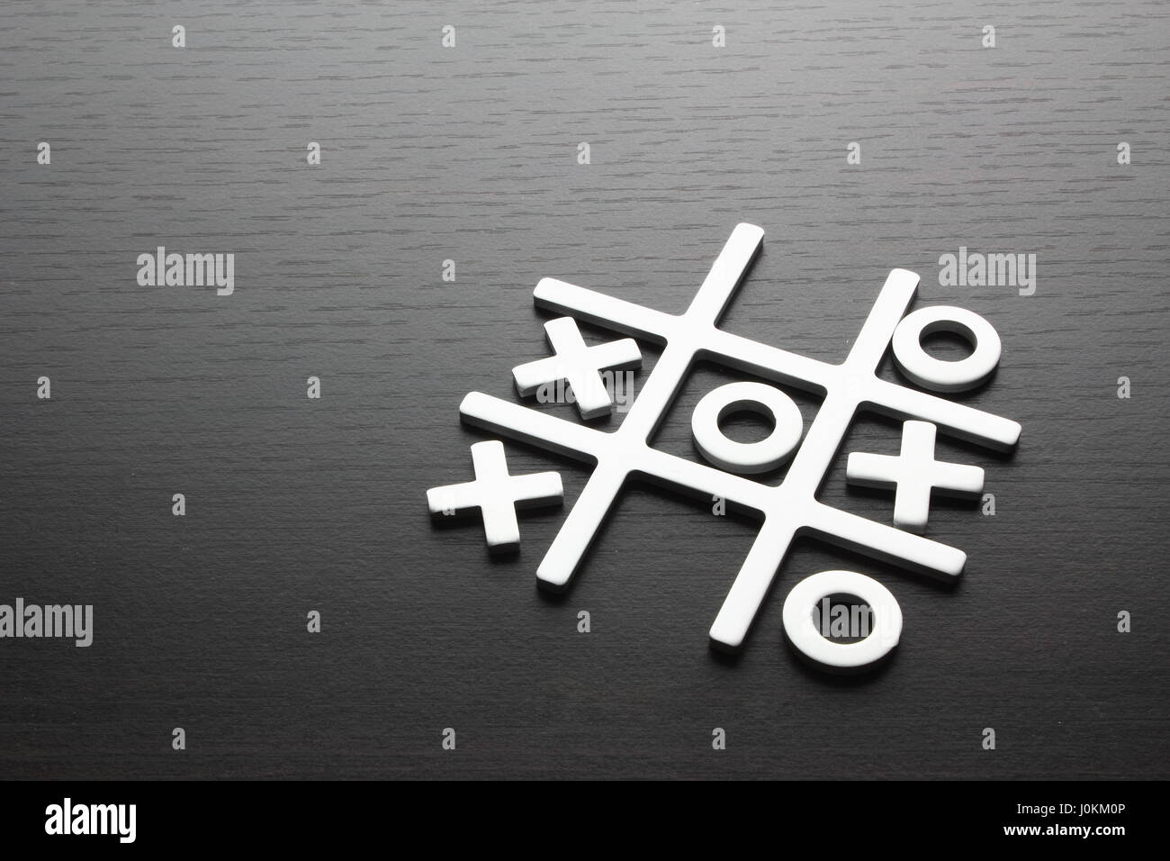 Tic Tac Toe Game on Wooden Background Stock Photo