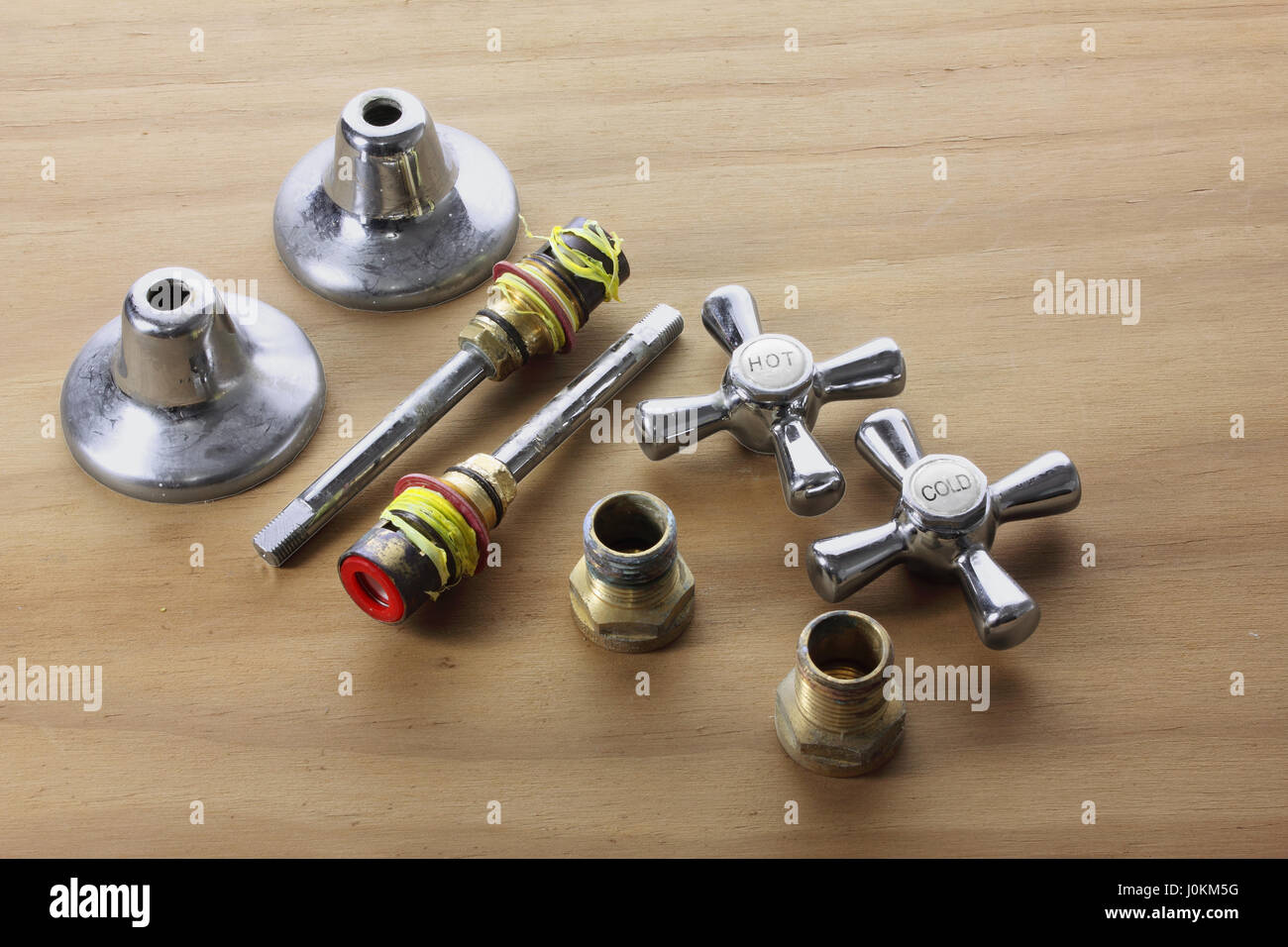 Taps and Accessories on Wooden Background Stock Photo