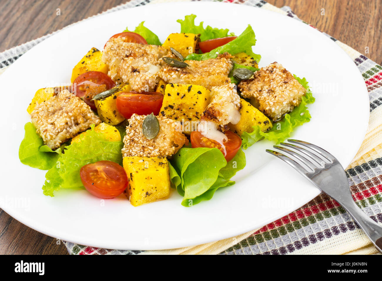 Warm grilled sulguni with vegetables. Studio Photo Stock Photo