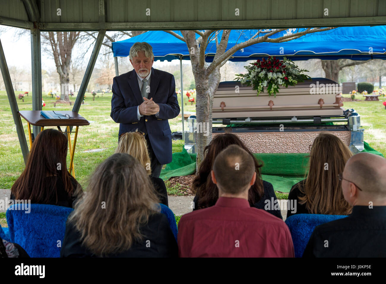 Pastor Offers Words Of Comfort At Graveside Funeral Service Stock