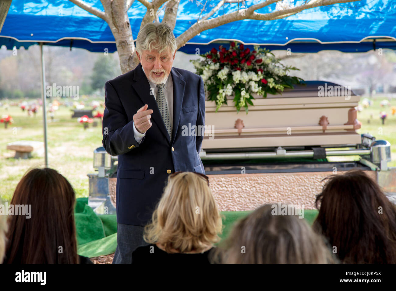 Pastor Offers Words Of Comfort At Graveside Funeral Service Stock