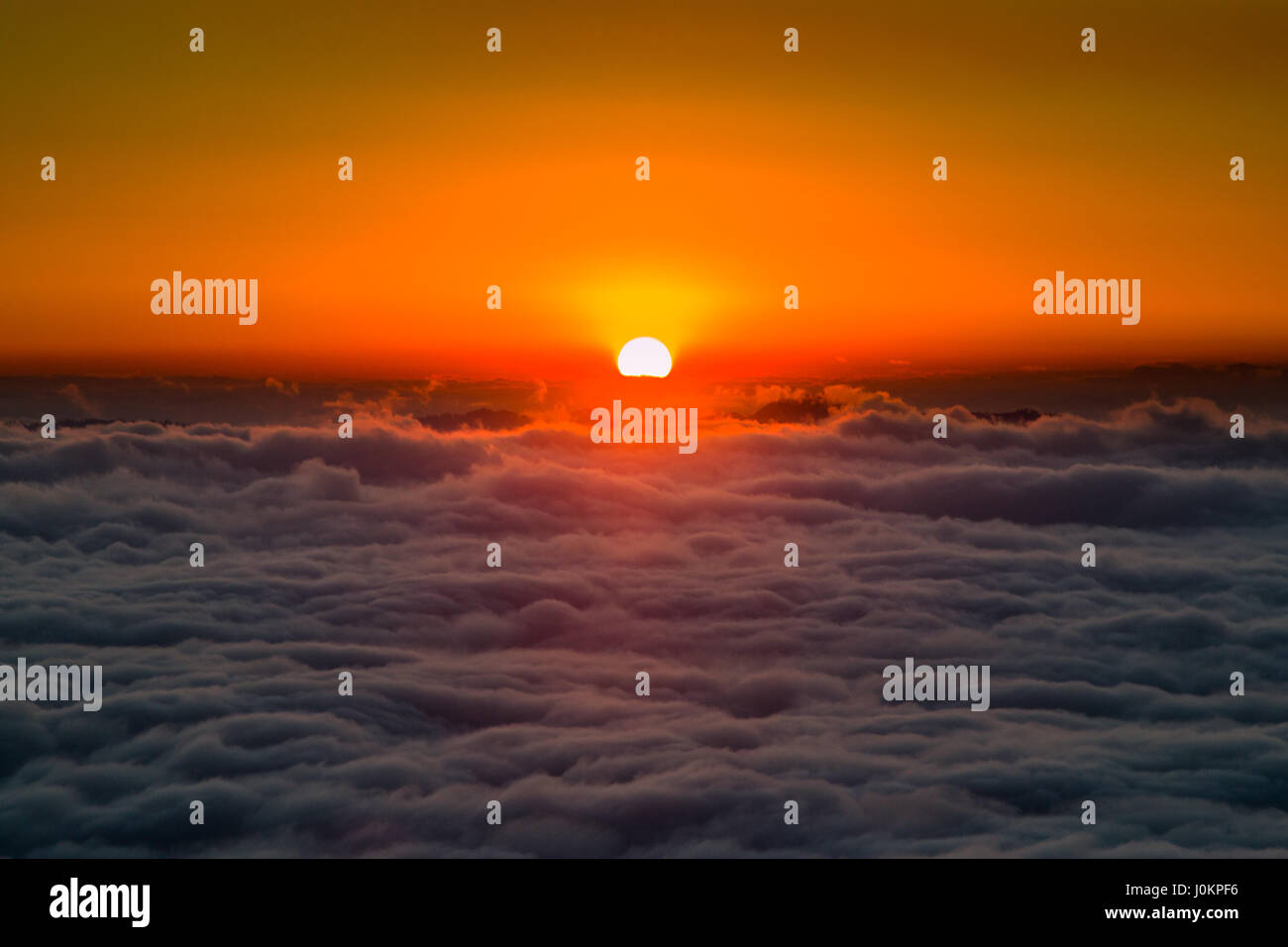 The sunset above a temperature inversion in the Himalayan region of ...