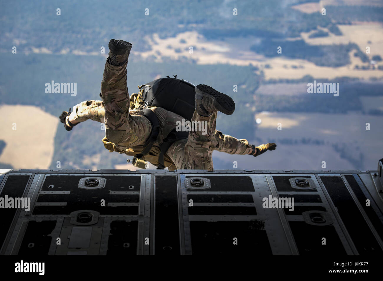 A pararescueman from the 38th Rescue Squadron jumps from an HC-130J Combat King II Stock Photo