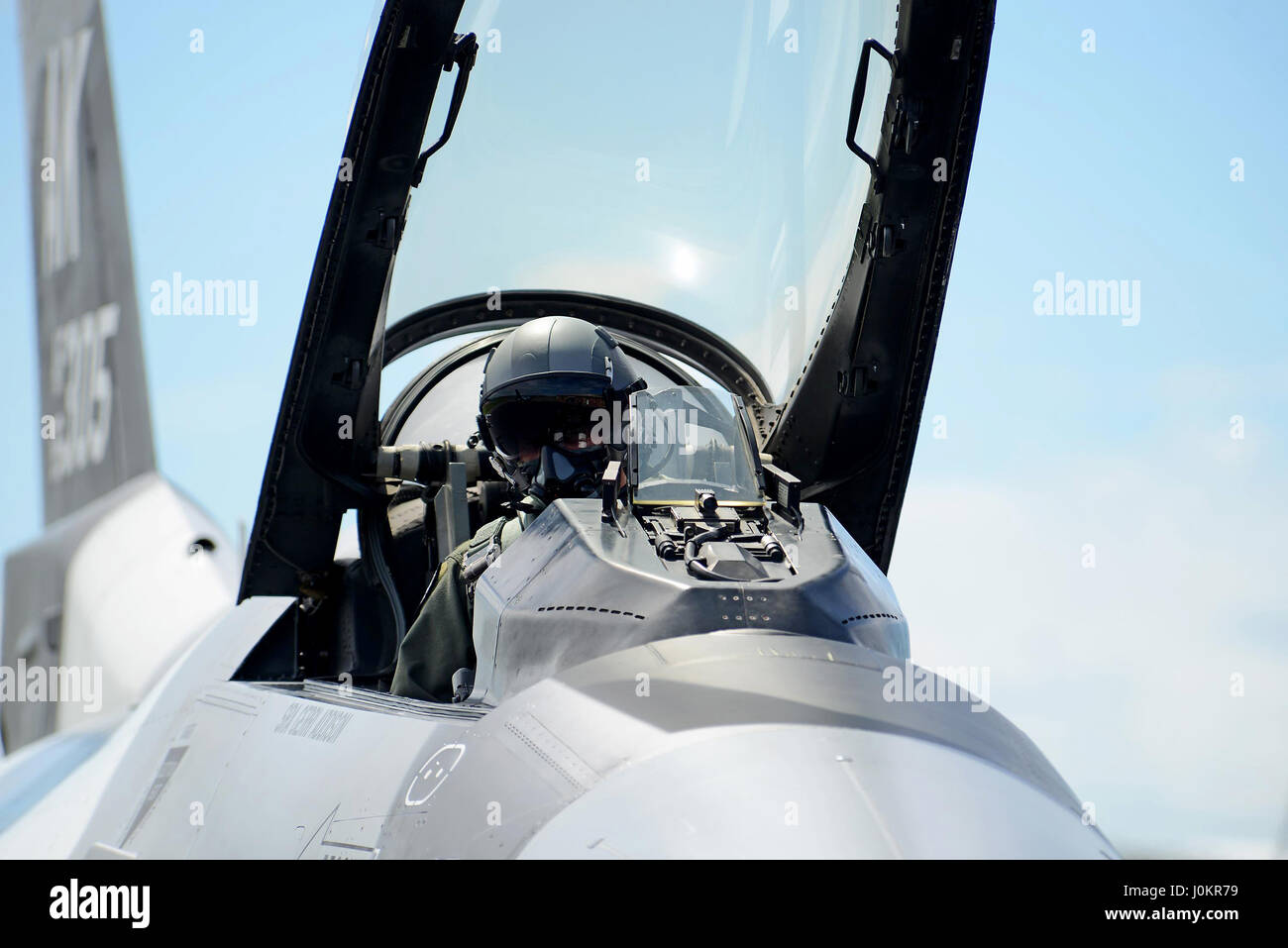 A pilot prepares for taxi in his F-16 Fighting Falcon Stock Photo