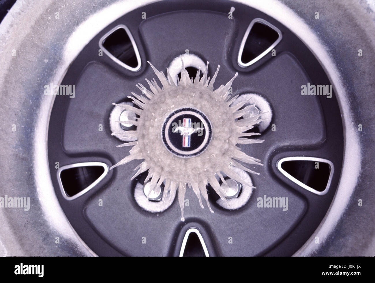 Radial Icicles on the hub of a automobile wheel Stock Photo