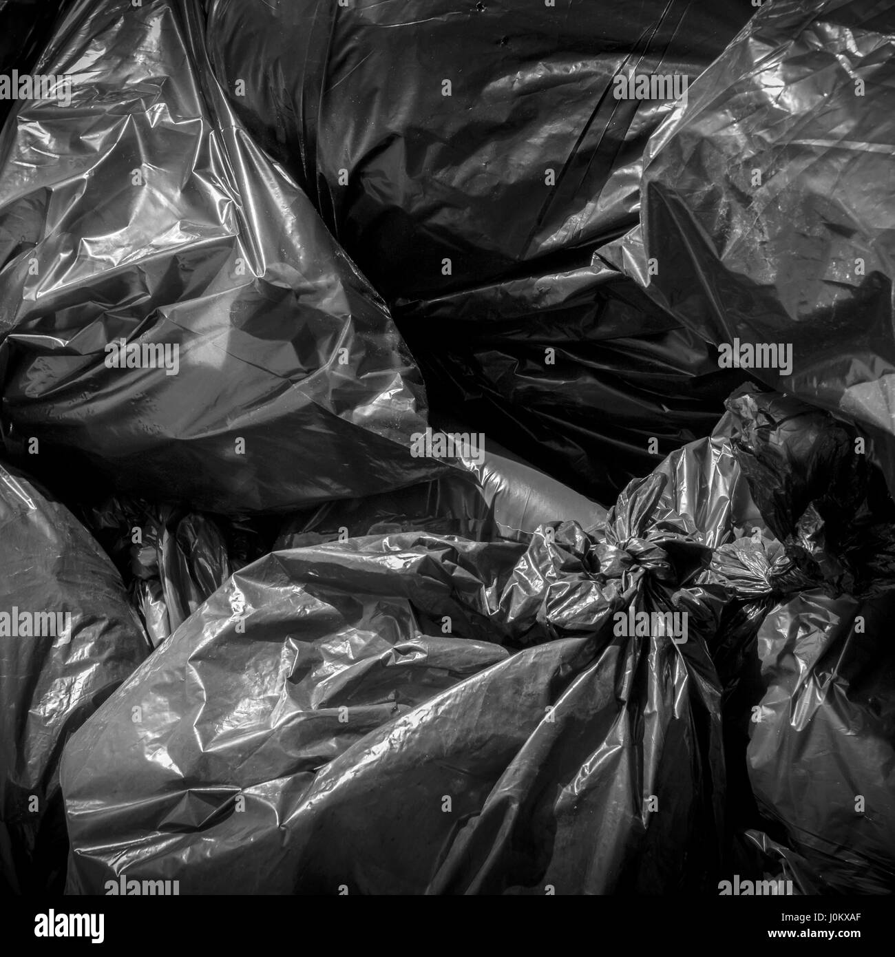 Textured of black plastic garbage bag for background Stock Photo