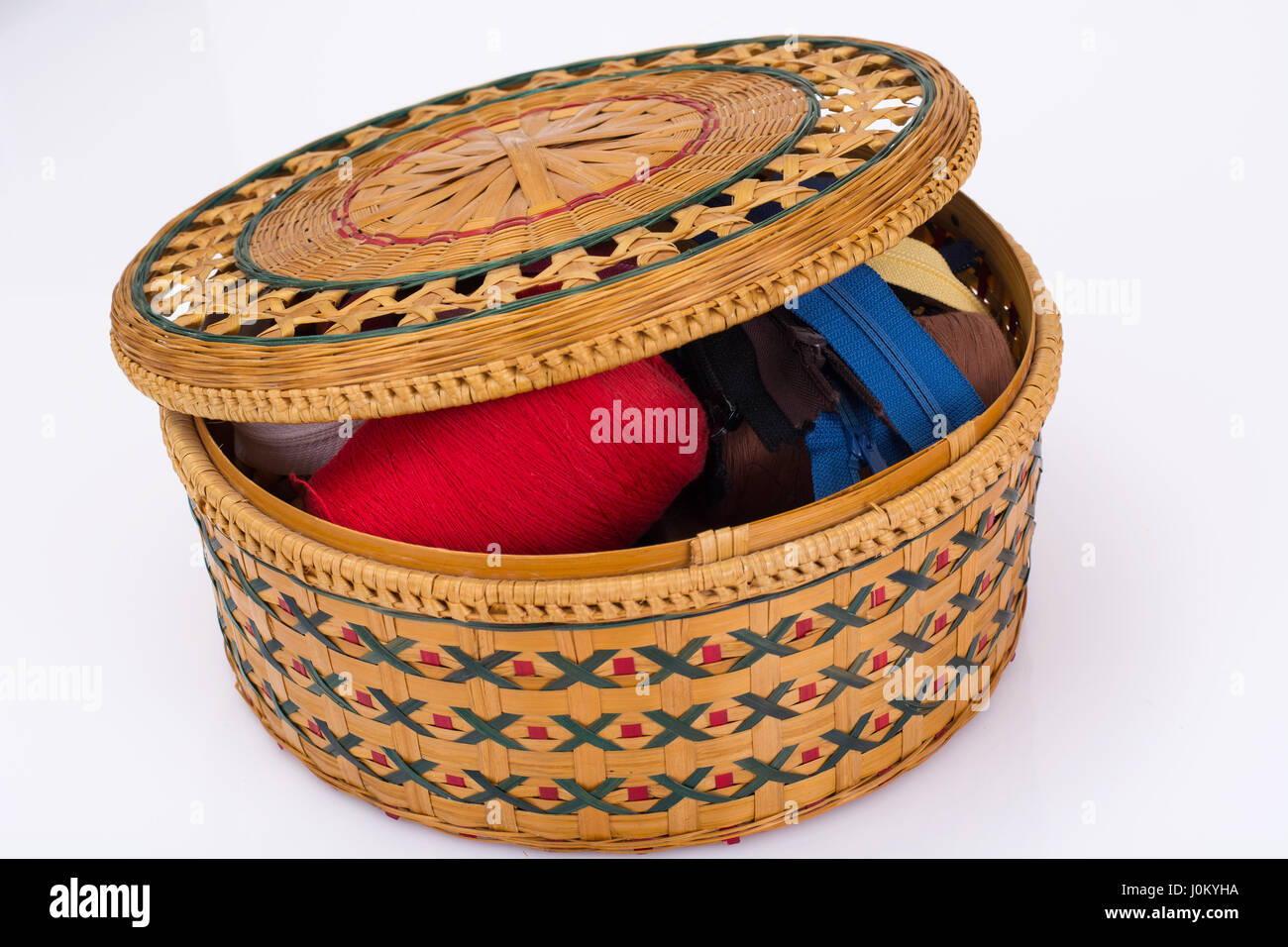 Wicker straw box for sewing accessories. Studio Photo Stock Photo - Alamy