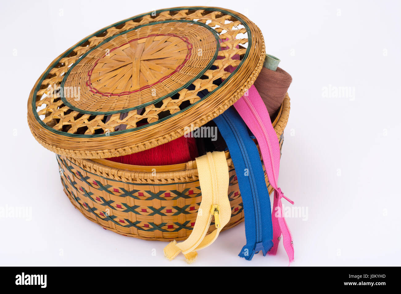 Wicker straw box for sewing accessories. Studio Photo Stock Photo - Alamy