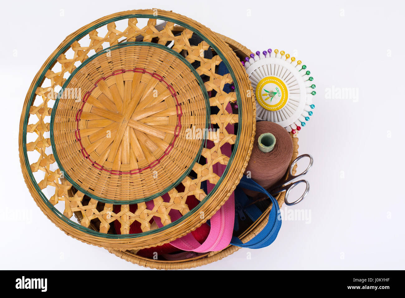 Wicker straw box for sewing accessories. Studio Photo Stock Photo - Alamy
