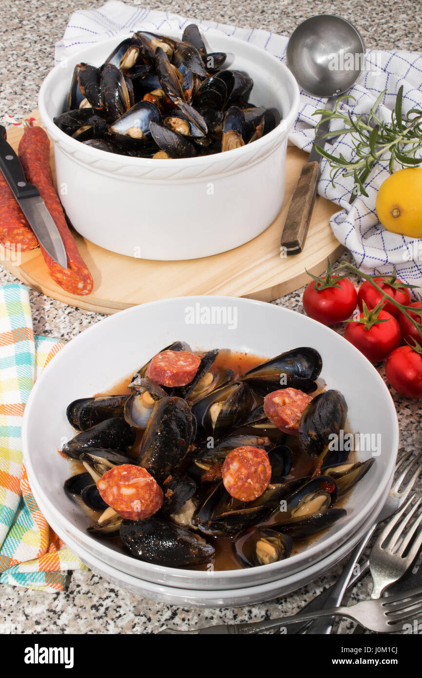 spanish mussels in a deep plate with chorizo Stock Photo Alamy
