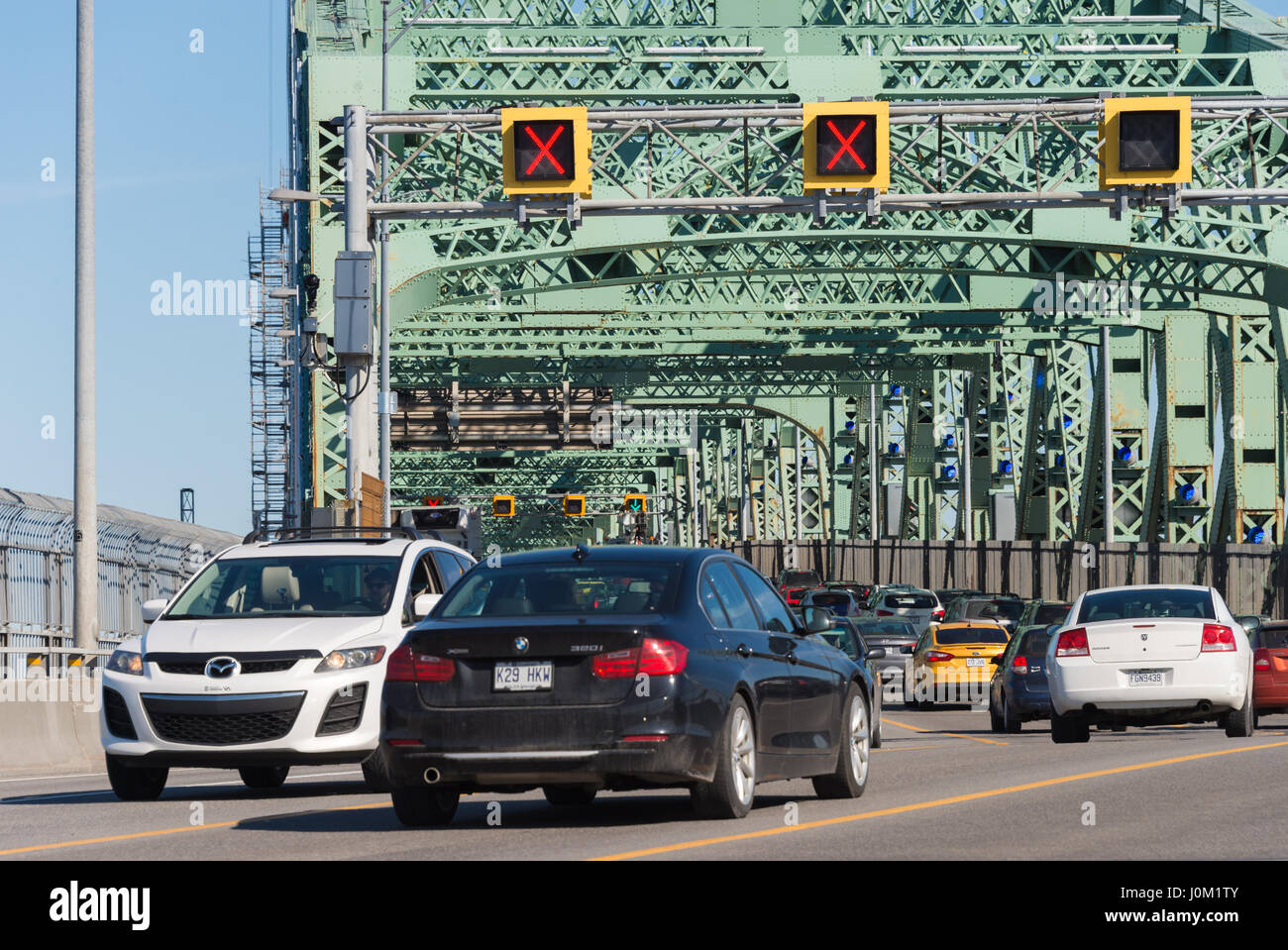 MONTREAL, CA - April 13th 2017. Traffic on Jacques Cartier bridge crossing Saint Lawrence river. Stock Photo