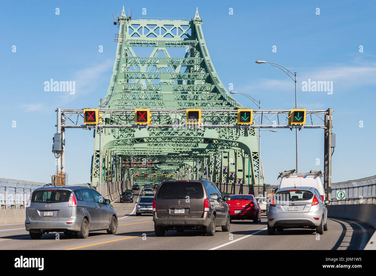 MONTREAL, CA - April 13th 2017. Traffic on Jacques Cartier bridge crossing Saint Lawrence river. Stock Photo