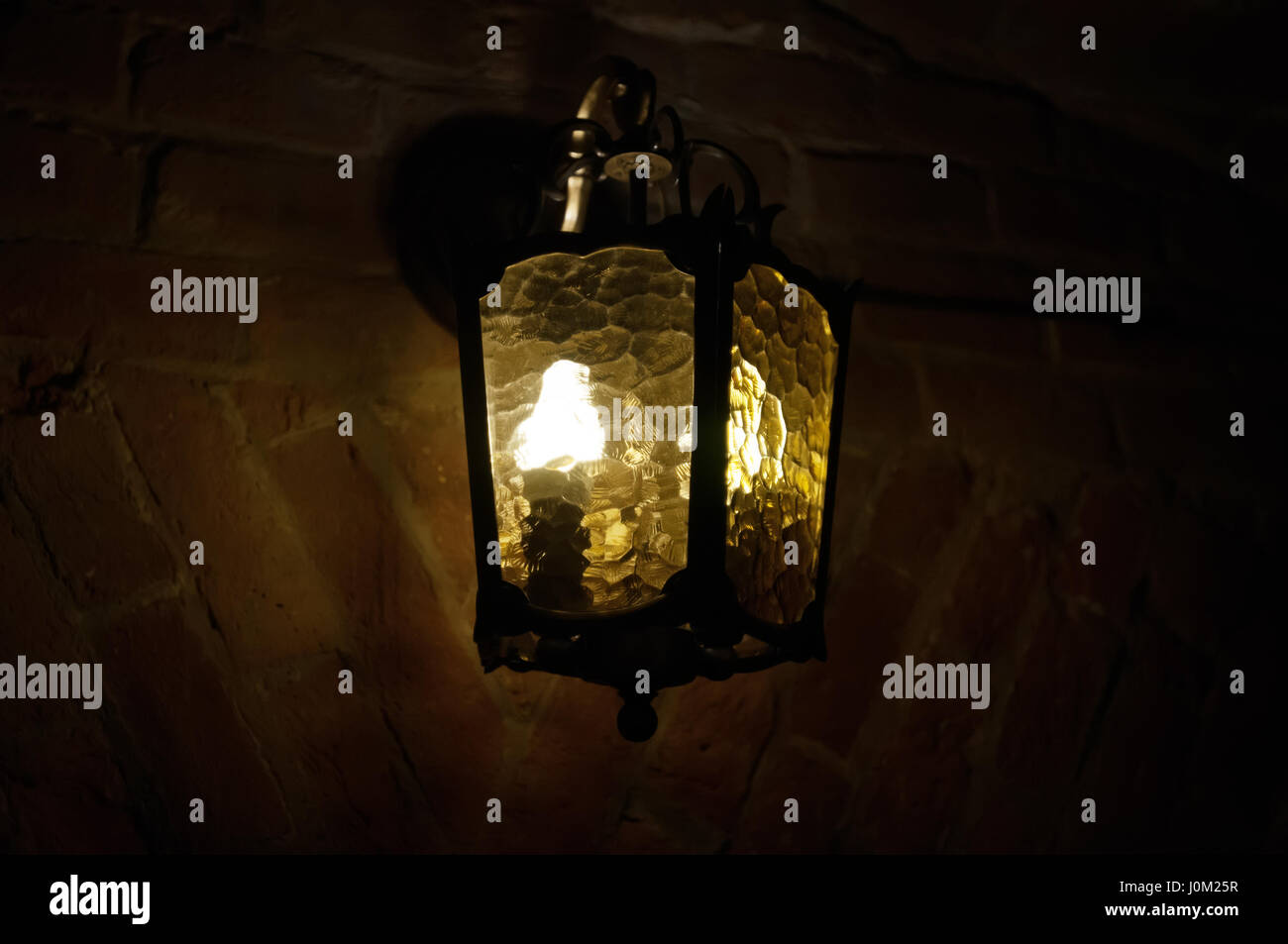 Old lantern illuminates wall hi-res stock photography and images - Alamy
