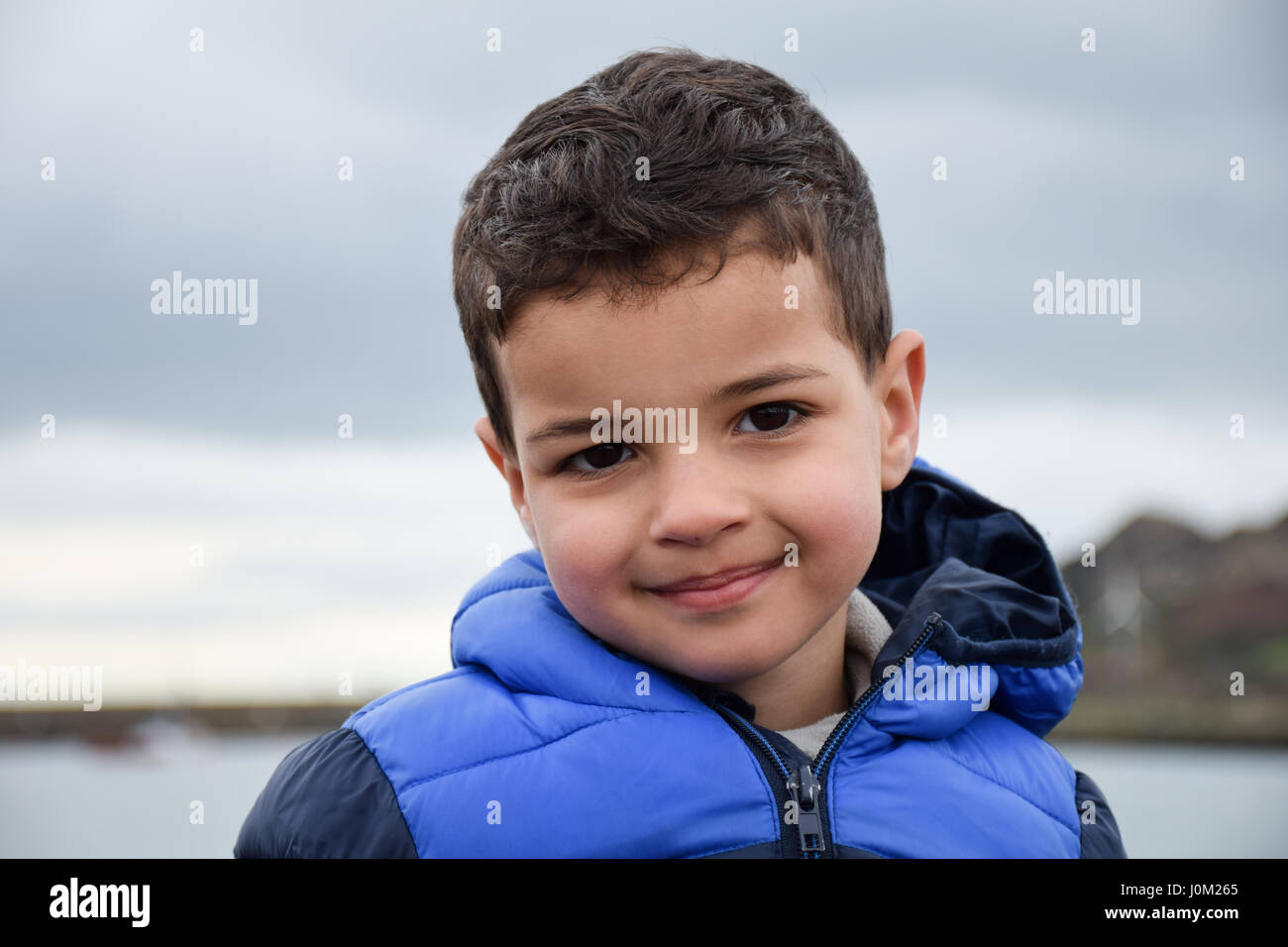 Boy with dark brown hair hi-res stock photography and images - Alamy