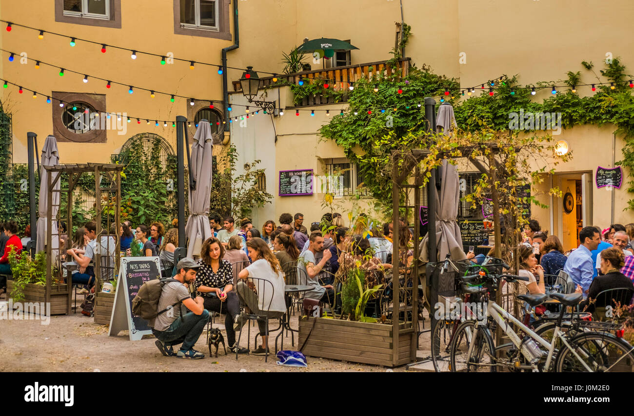 young people having a drink on the terrace of cafe bar les savon d´helene  Stock Photo - Alamy