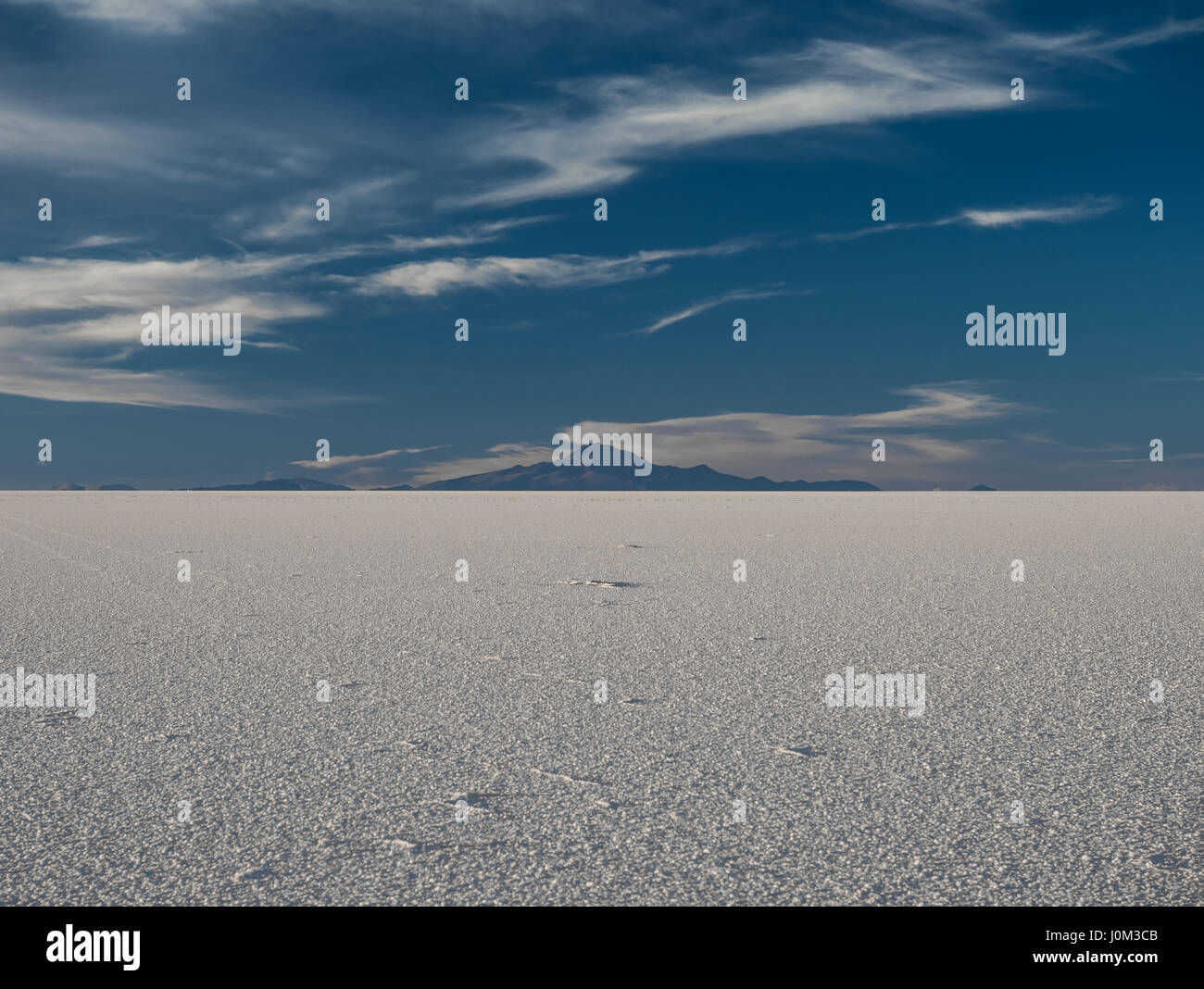 Mount Tunupa, a dormant volcano in the Potosi Department of southwestern Bolivia, stands on the northern side of the Salar de Uyuni. Stock Photo