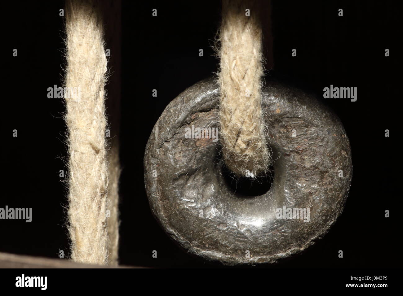 Lead weight for grandfather clock with rope Circa 1800 Stock Photo Alamy