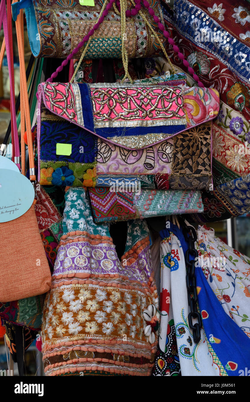 Handbags on sale in a pavement market in Stock Photo