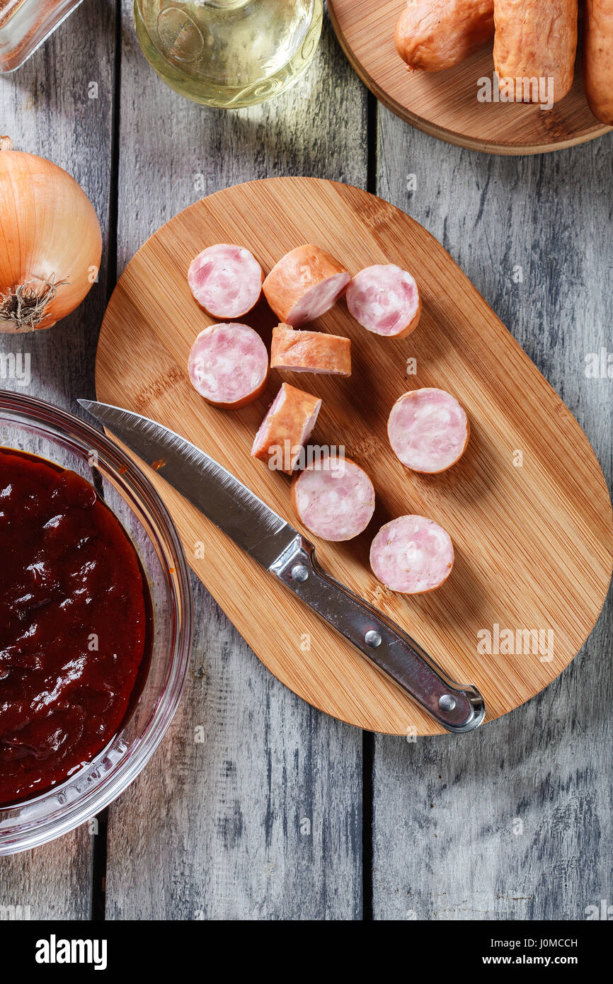 Ingredients ready for preparing German currywurst with curry sauce ...