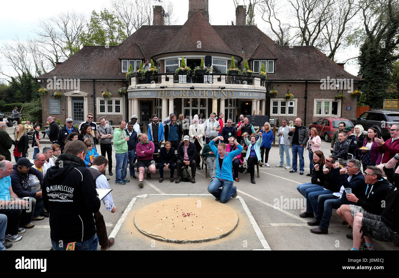 Lisa Hodgson of the Rolling Drunks marbles team reacts after taking a shot during the British and World Marbles Championships at The Greyhound Inn near Crawley in West Sussex. Picture date: Friday April 14, 2017. See PA story SOCIAL Marbles. Photo credit should read: Gareth Fuller/PA Wire Stock Photo