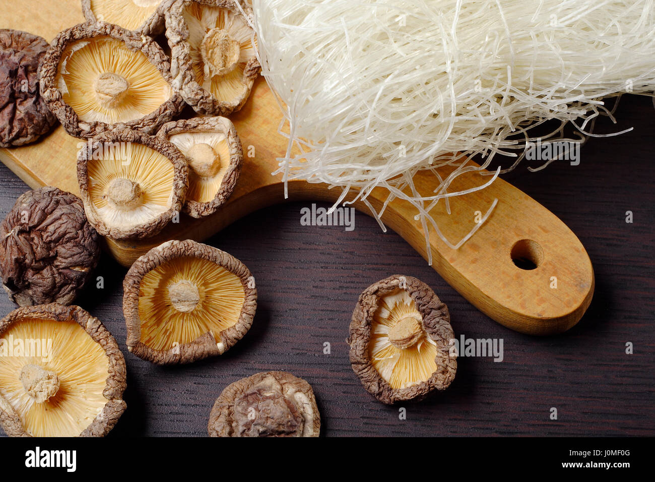 Still life with shiitake mushrooms (Poku) (Lentinus edodes) and rice nodles. Stock Photo