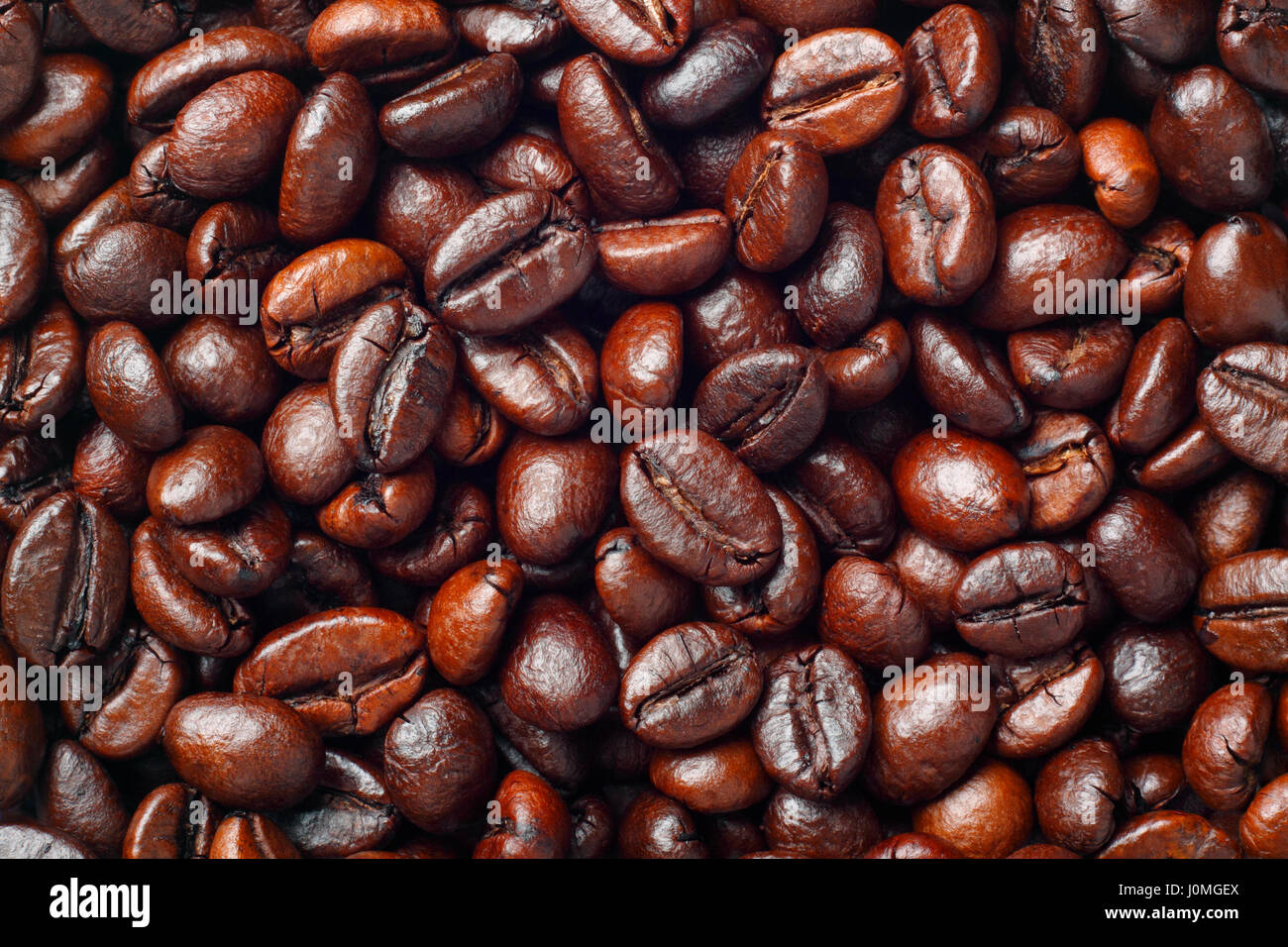 Coffee beans (Robusta coffee) closeup. Full frame, top view Stock