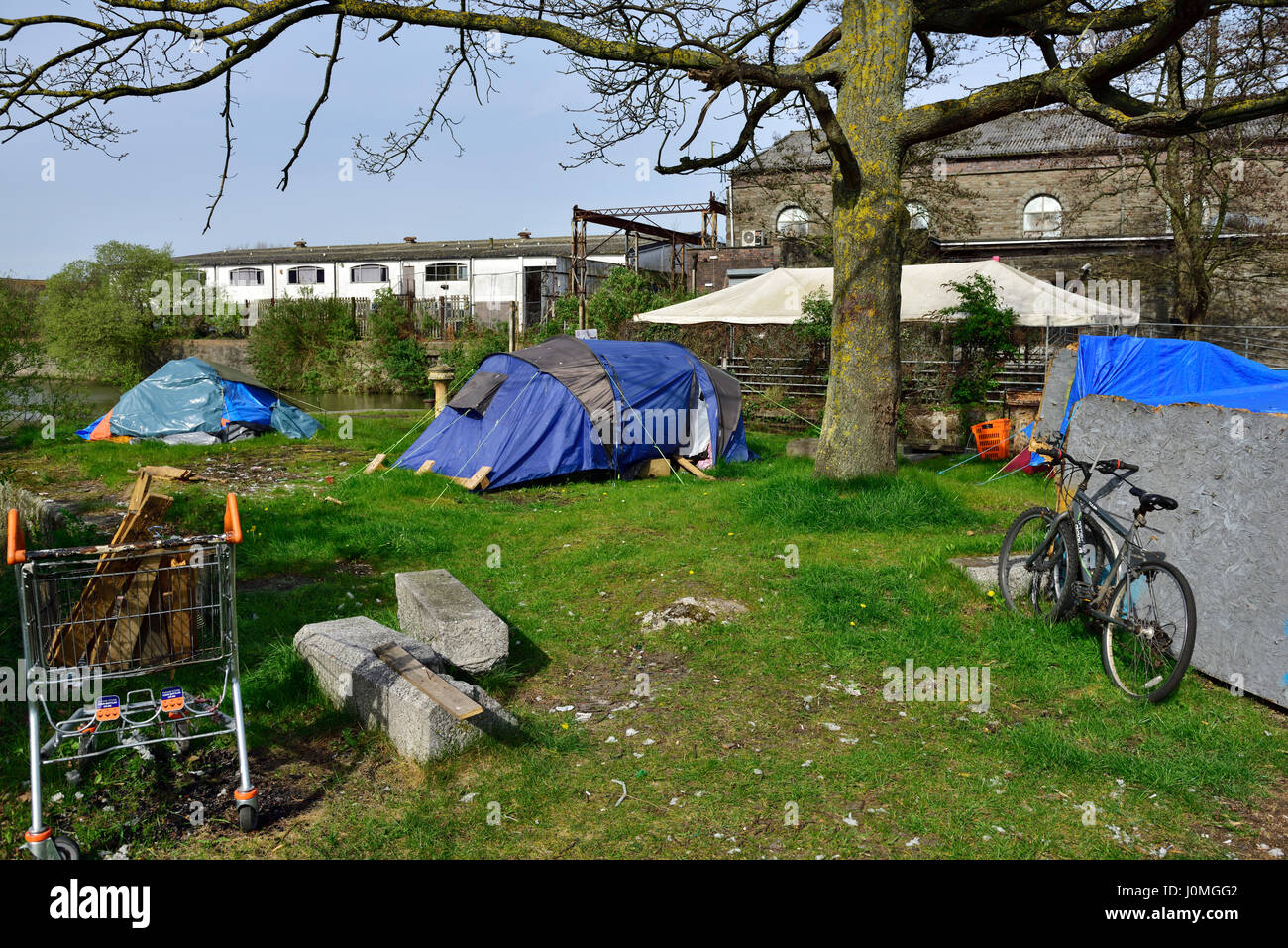 Makeshift housing in tents and tarpaulins as temporary unofficial homeless accommodation, Bristol, UK Stock Photo