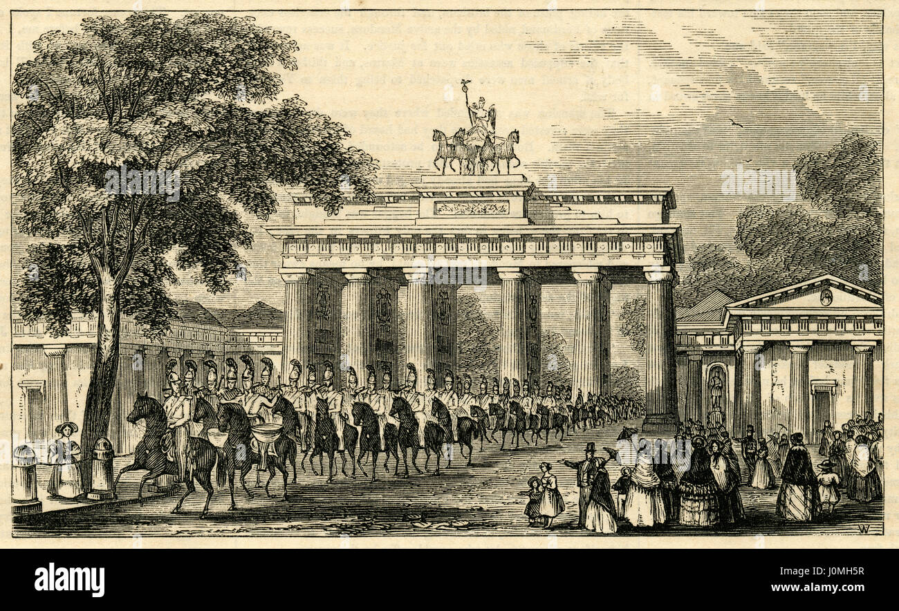 Antique 1854 engraving, 'Brandenburg Gate at Berlin, Prussia.' The Brandenburg Gate (German: Brandenburger Tor) is an 18th-century neoclassical monument in Berlin, and one of the best-known landmarks of Germany. It is built on the site of a former city gate that marked the start of the road from Berlin to the town of Brandenburg an der Havel. SOURCE: ORIGINAL ENGRAVING. Stock Photo
