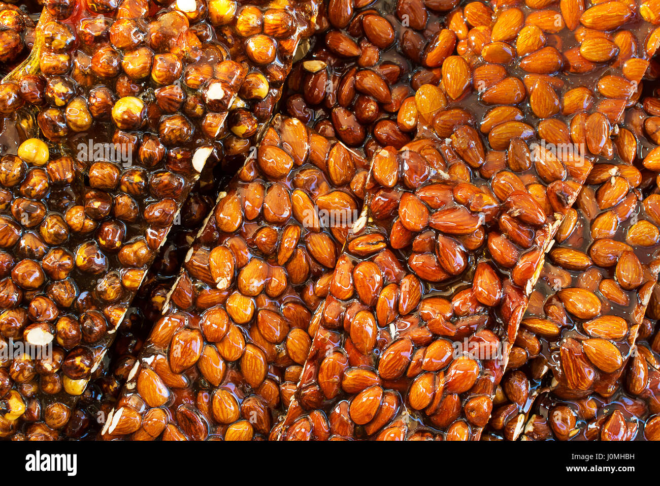 Heap of crunchy almond on tray Stock Photo