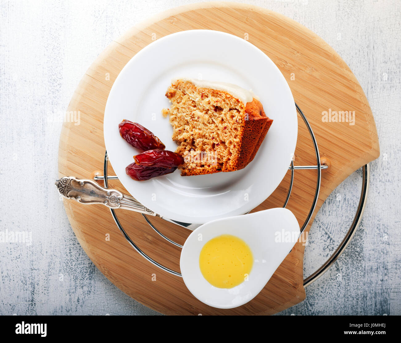 Slice of date cake and dates Stock Photo Alamy