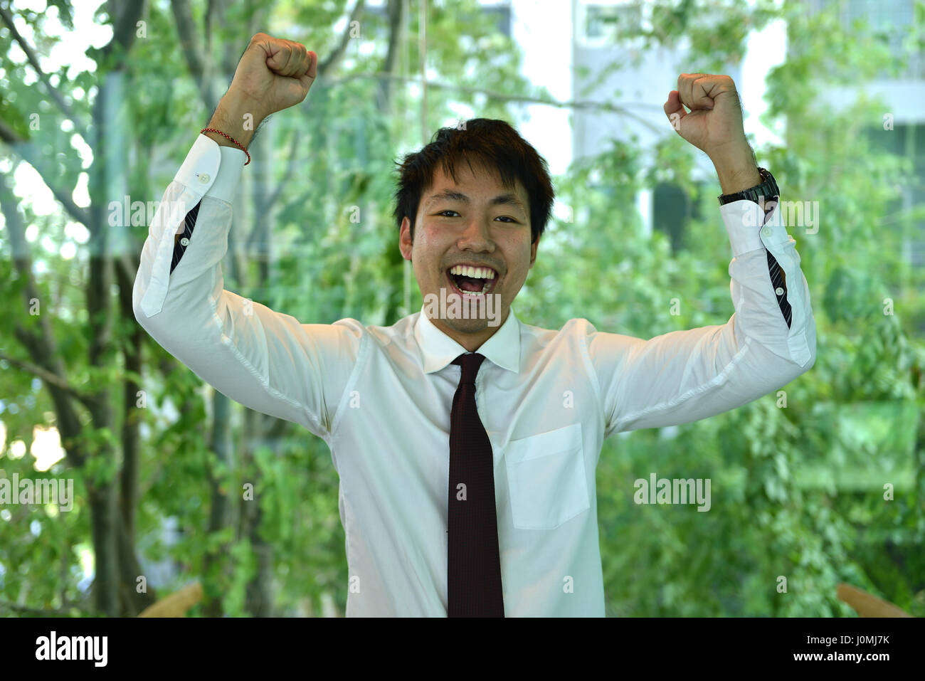 Portrait of Asian business man is happy, person smiling Stock Photo - Alamy