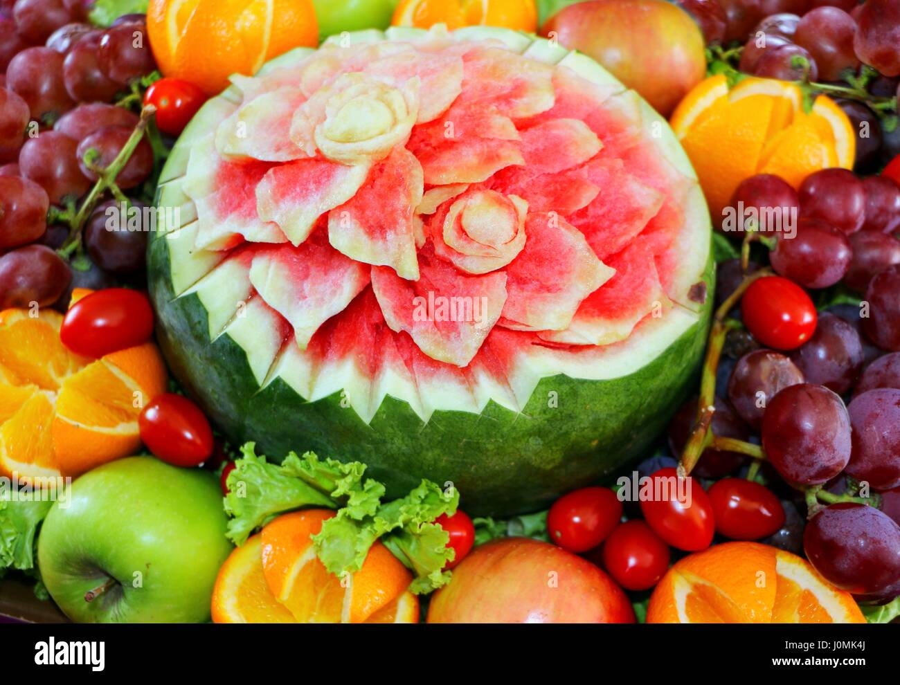 Watermelon fruit carved flower shape and fruits Stock Photo Alamy