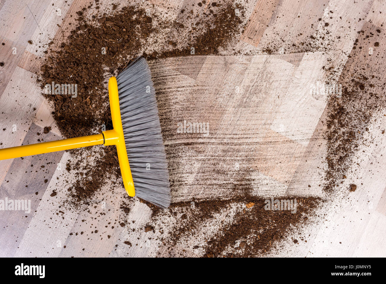 Closeup top view of broom sweeping floor with soil Stock Photo Alamy
