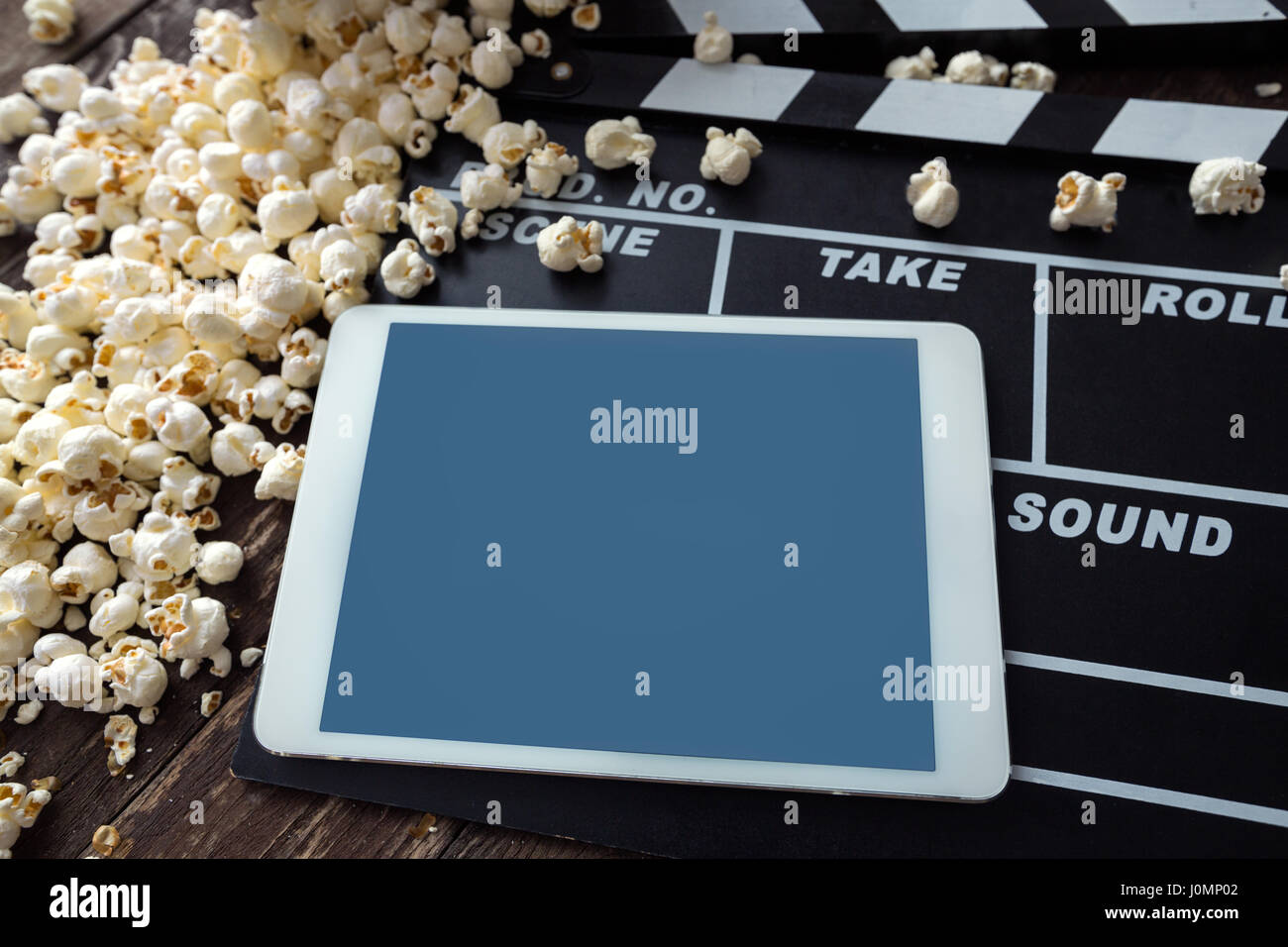 digital tablet with fresh popcorn Stock Photo - Alamy
