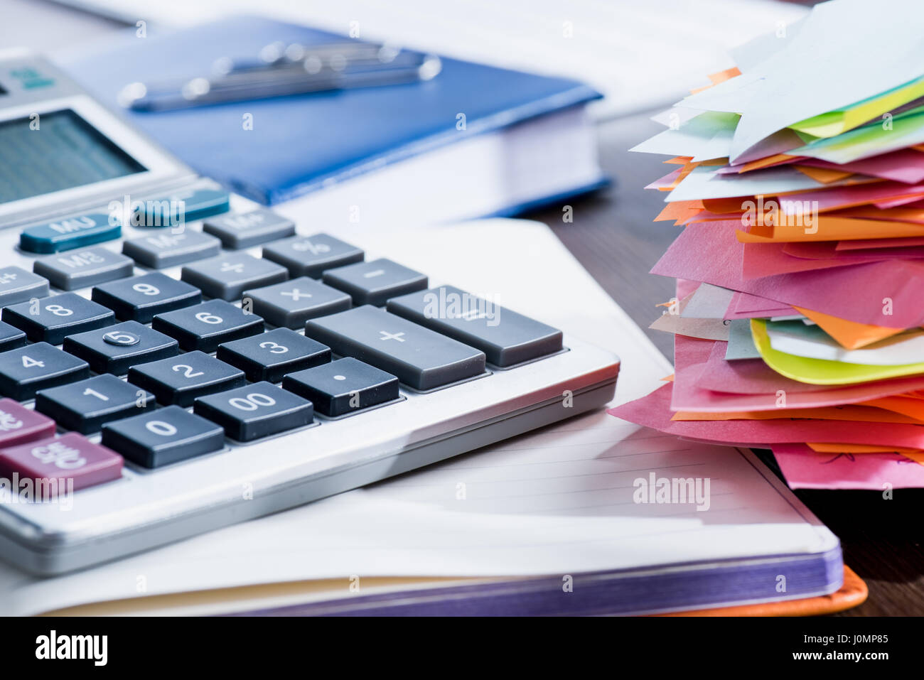 Close-up view of calculator, notebook and office supplies at workplace Stock Photo