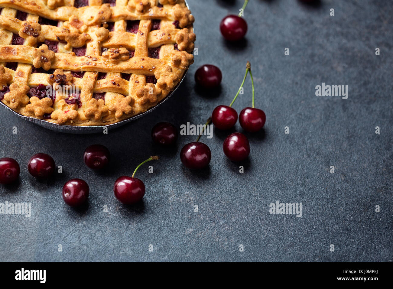 traditional cherry pie and fresh cherry top view -copy space Stock Photo