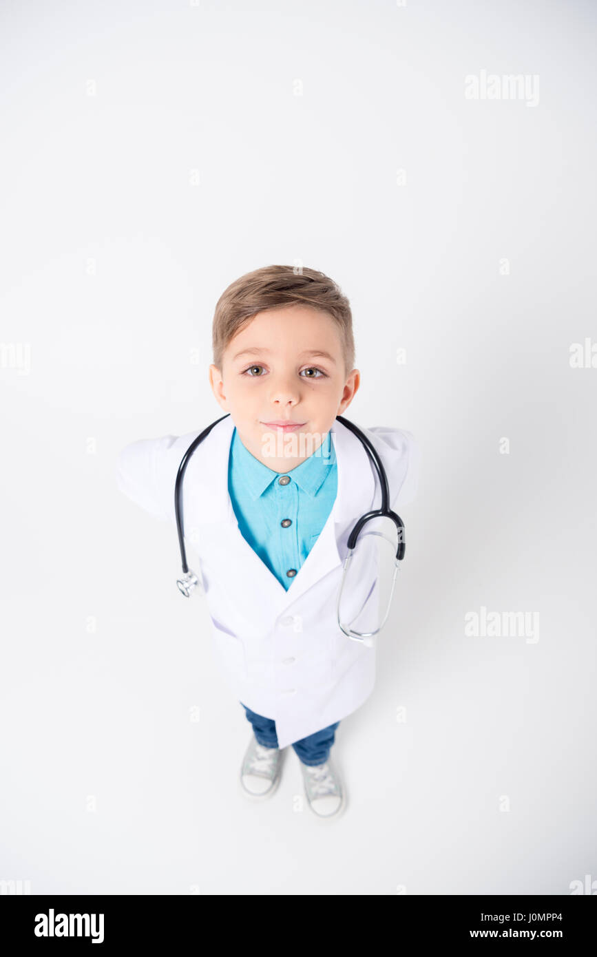 Little boy in doctor costume with stethoscope smiling at camera Stock