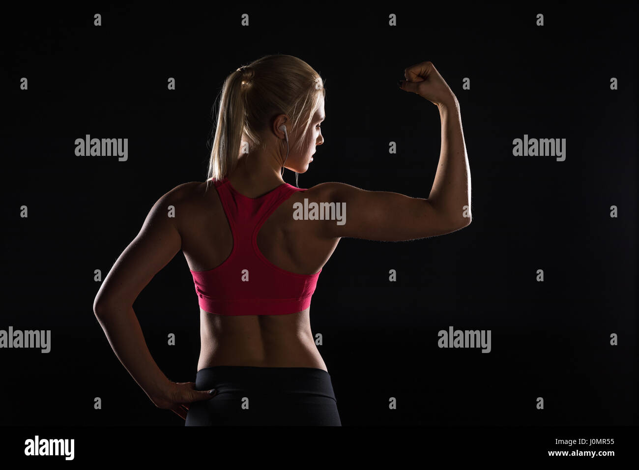 Back view woman showing muscles hi-res stock photography and images - Alamy