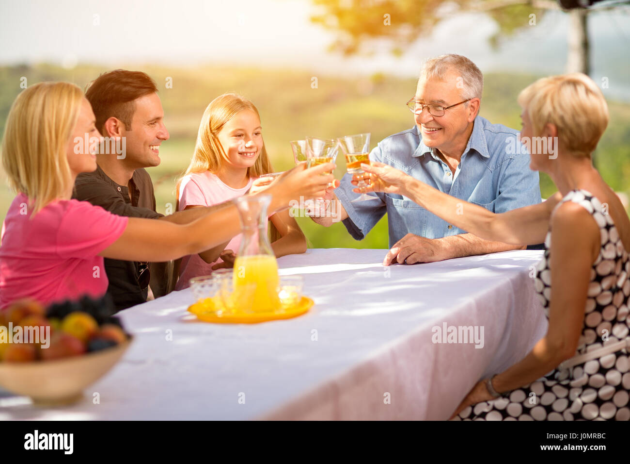 family celebrate party picnic joyful lifestyle drinking concept Stock Photo
