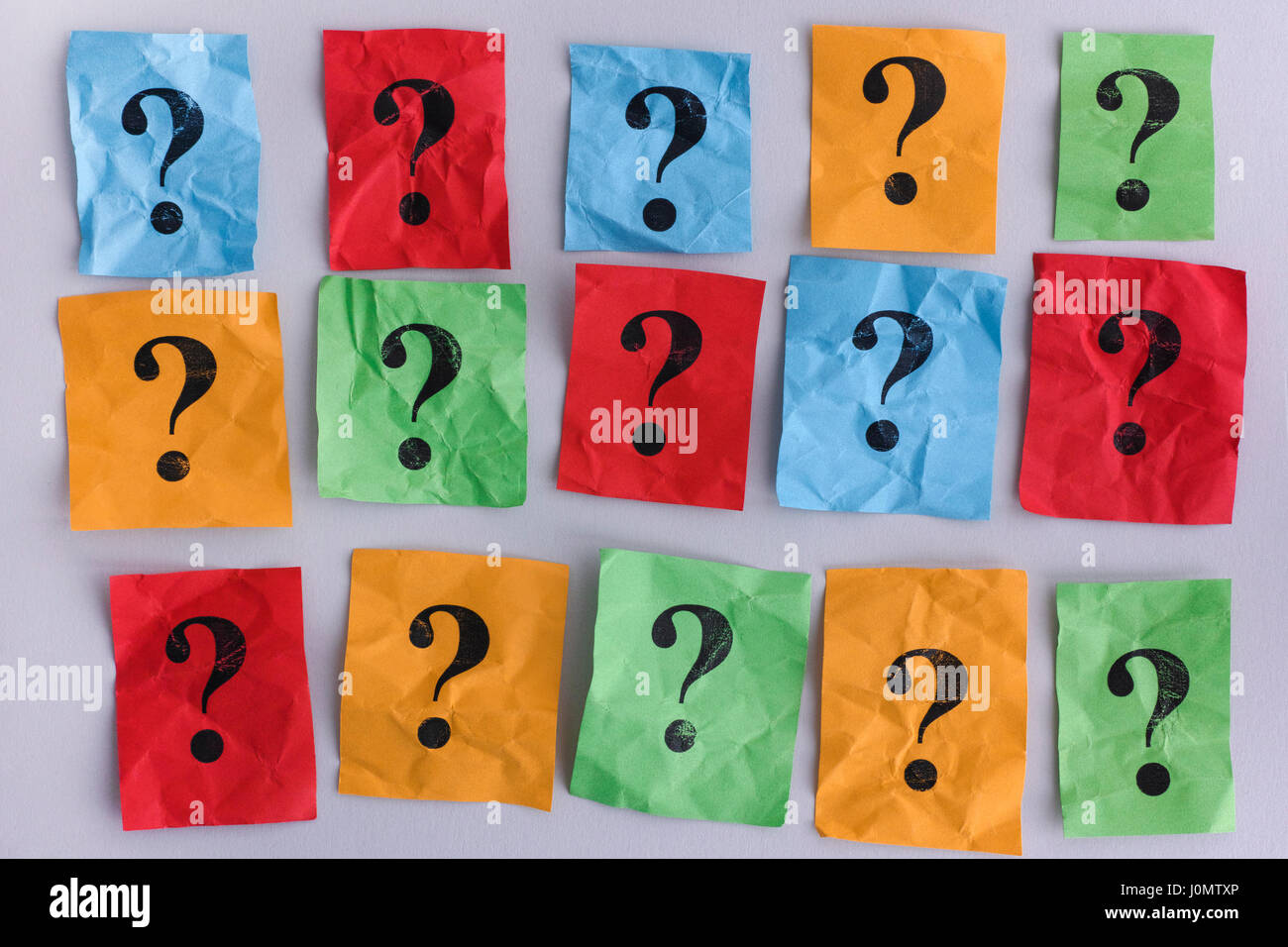 Question marks. Colorful paper notes with question marks. Concept image. Closeup. Stock Photo